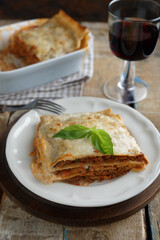 Lasagna Bolognese on a rustic table