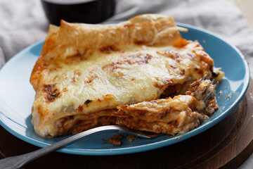 Lasagna Bolognese on a rustic table