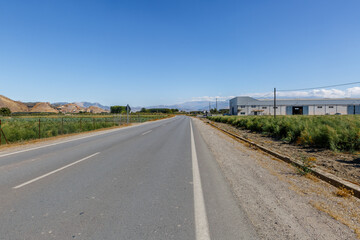 View of a large road in the middle of a landscape, on a sunny day