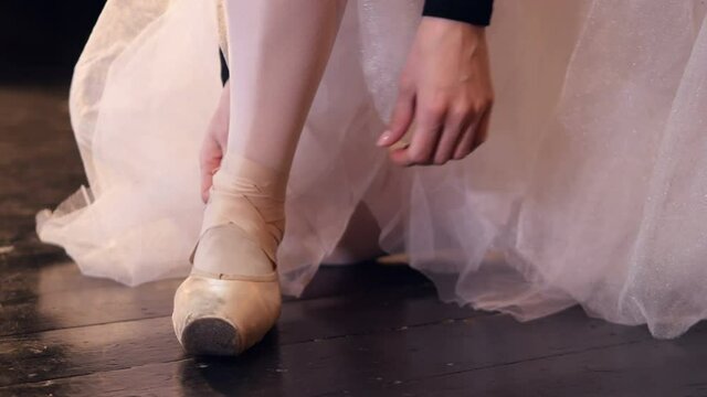 Dancer putting on her shoes