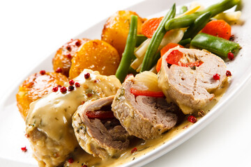 Meatballs with potatoes and vegetables on white background 