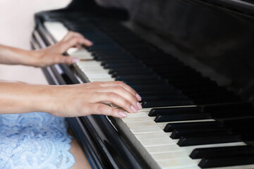 Fototapeta premium Woman playing piano
