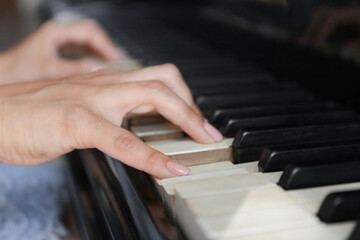 Fototapeta premium Woman playing piano
