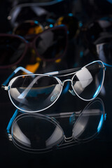 various sunglasses on a dark background
