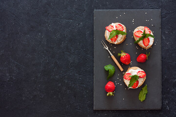 Toasts with oat  bread, ricotta and fresh strawberries