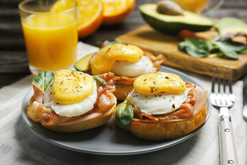Tasty eggs Benedict on plate
