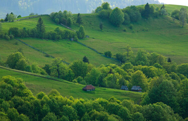 Rural landscape village and fields in mountains