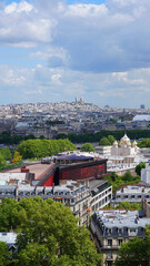 Aerial view of city of Paris from Eiffel tower with beautiful scattered clouds, Paris, France