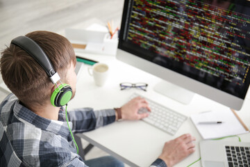Young programmer at workplace