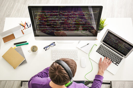 Young programmer at workplace