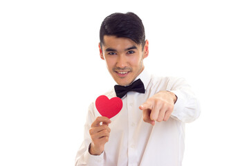 Young man holding a read heart 