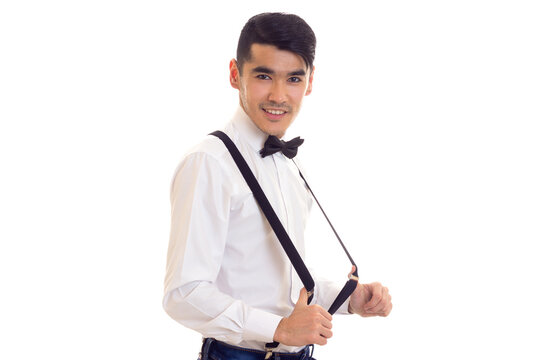 Young man with bow-tie and suspenders