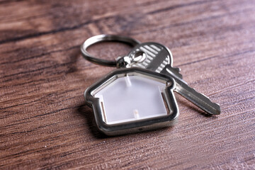 Key on wooden background