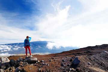 Tourist admiring breathtaking view of Mauna Loa volcano on the Big Island of Hawaii, USA