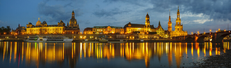 Fototapeta na wymiar view of the historic part of Dresden, city lights reflecting on the River Elbe.