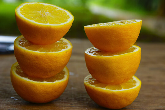 Yellow Fresh Lemon Slice Over Wooden Background