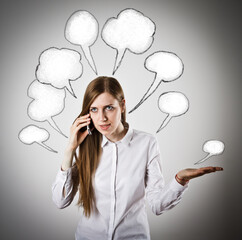 Woman in white with telephone and blank speech bubbles over her head.