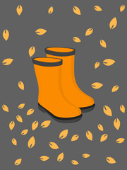 A pair of rainy boots with autumn leaves decoration