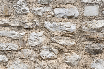 Weathered old sandstone and granite wall background