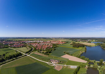 Fototapeta na wymiar Aerial view of a small lake in the district of Buechenbach of the city of Erlangen