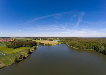 Aerial view of a small lake in the district of Buechenbach of the city of Erlangen