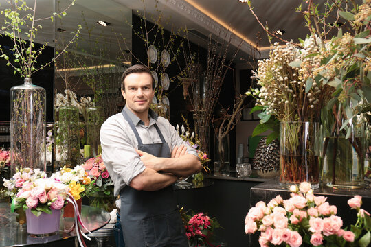Handsome florist in flower shop