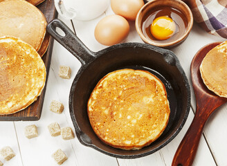 Homemade pancake in the frying pan on the table