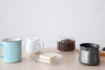 Composition with ingredients for bulletproof coffee on table