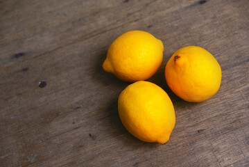 Yellow Fresh Lemon Over Wooden Background