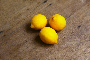 Yellow Fresh Lemon Over Wooden Background
