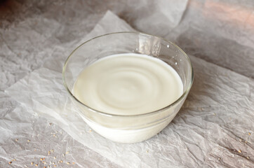 The milk is poured in a glass dish.