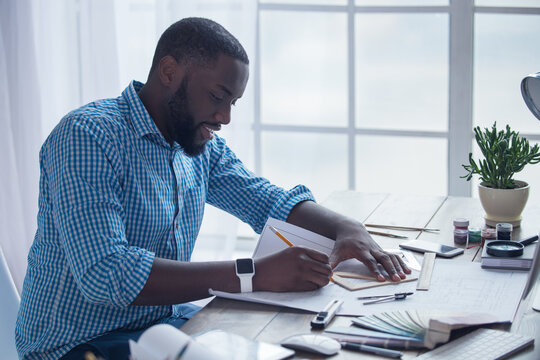 Young african man working in the office business