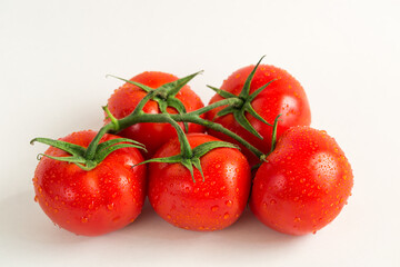 Red fresh tomatoes isolated on white background