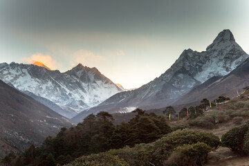 Sunrise in Himalayas. Ama Dablam, Nuptse, Lhotse and Everest in first rays of sun. Two eight-thousander peaks. View from Tengboche. Sagarmatha National Park, Solukhumbu District in Nepal, Asia. 
