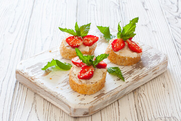 Toasts with oat  bread, ricotta and fresh strawberries