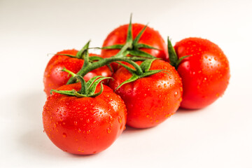 Red fresh tomatoes isolated on white background