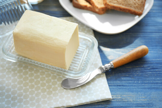 Composition with butter on wooden table