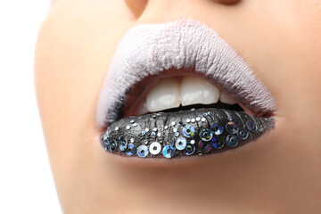 Female lips with creative make up, closeup
