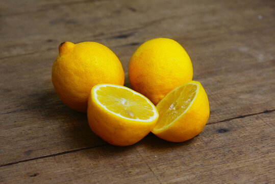 Yellow Fresh Lemon Slice Over Wooden Background
