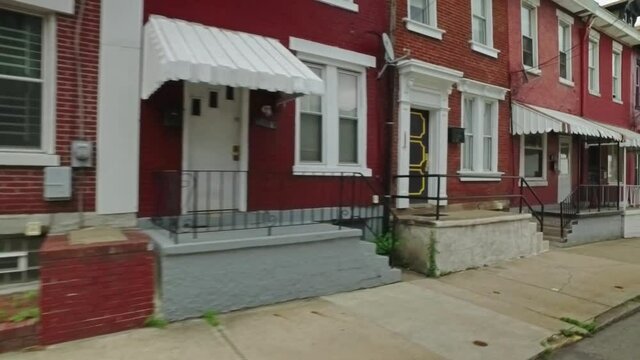 A dolly establishing shot of middle to low income row houses on Pittsburgh's Hill District.  	