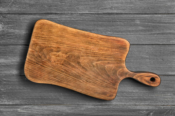Cutting board on wooden background