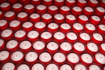 A lot of red thick candles background top view