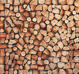 Pile of natural wooden parts of logs for background, top view