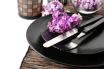 Obraz na płótnie Canvas Beautiful festive table setting with lilac flower decor on white background