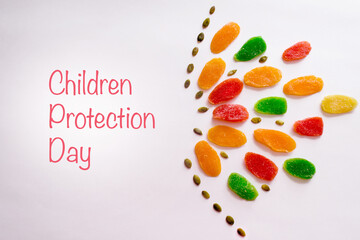 International Day of Innocent Children Victims of Aggression, Childrens protection day. Multicolored pineapple candied fruits as a useful alternative to sweets