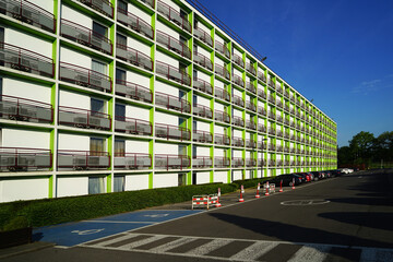 Modern building with balconies on sunny day