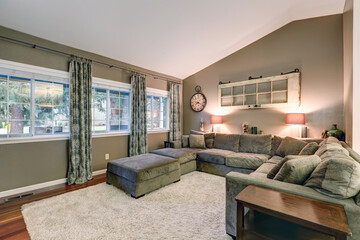 Vaulted ceiling family room with taupe walls paint color