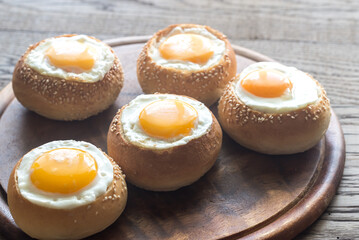 Egg-in-a-hole buns on the wooden board