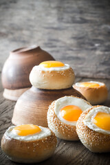 Egg-in-a-hole buns on the wooden board