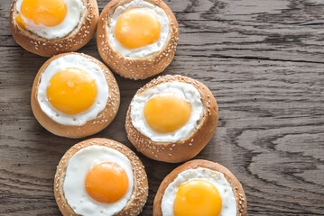 Egg-in-a-hole buns on the wooden board